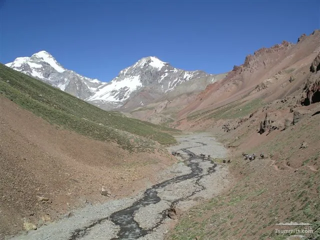 View from the Relinchos valley (Polish traverse route, vacas side) towards Aconcagua (left). You can see the mules crossing the river.