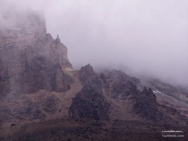Lava spires on kili's gloomy upper slopes.