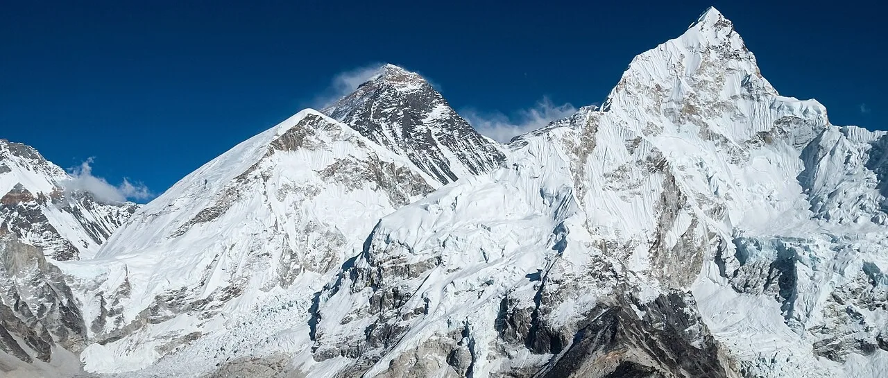 Mount Everest summit pyramid rising above the Khumbu Icefall and glacier