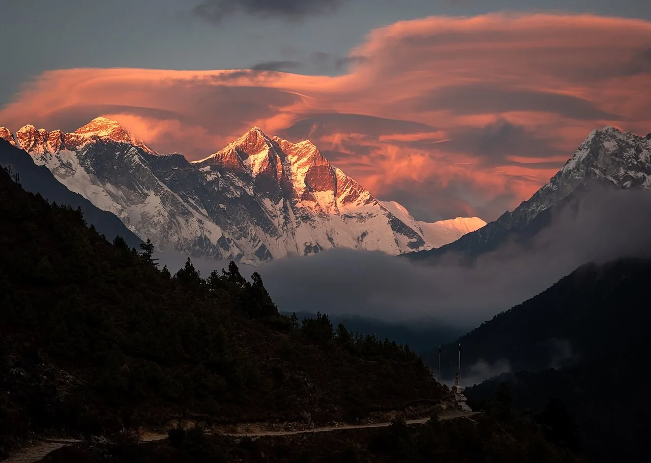 Mount Lhotse bathed in golden sunset light, viewed from Nepal trek route