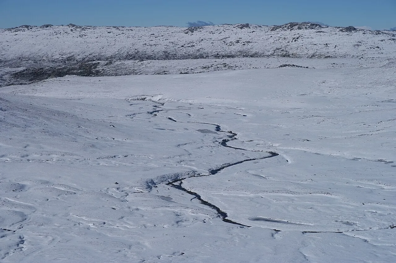 Snow-covered landscape towards Mount Kosciuszko summit walk, Kosciuszko National Park, Australia