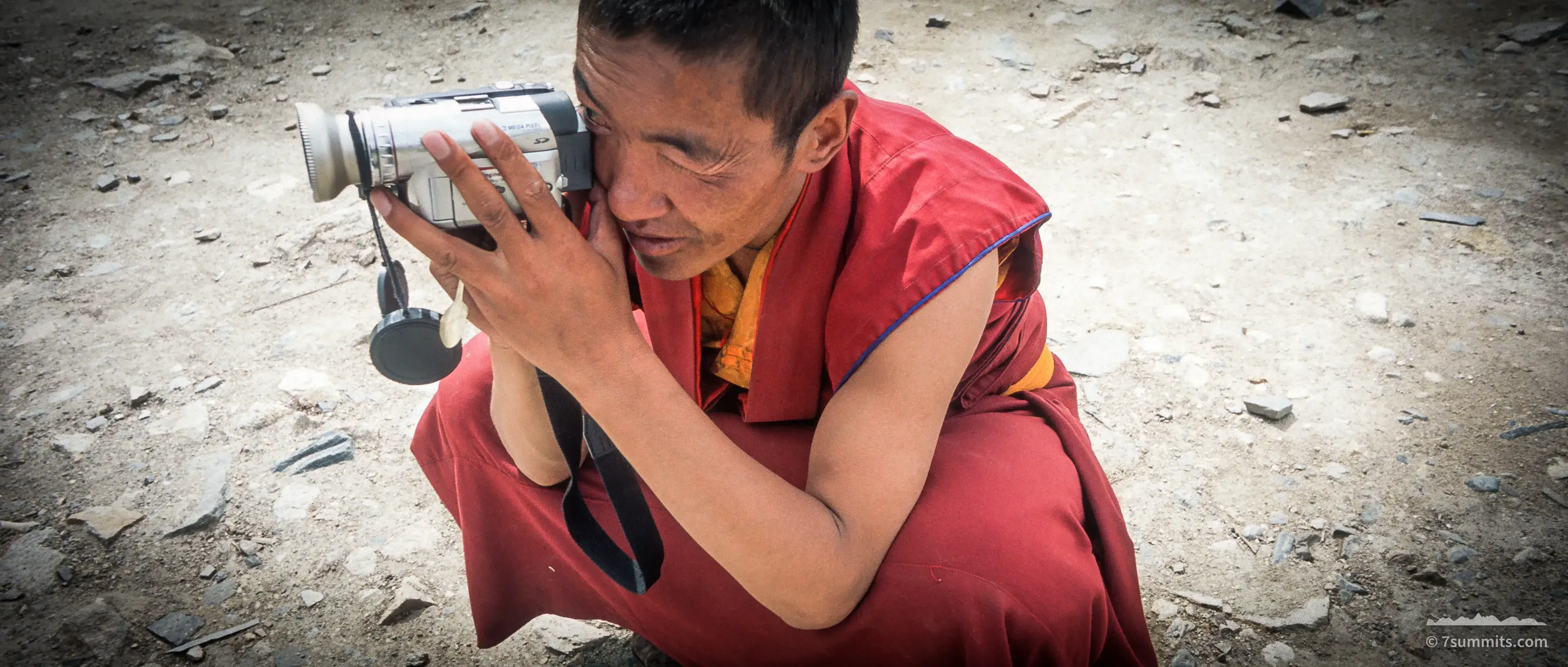 Monk with video camera
