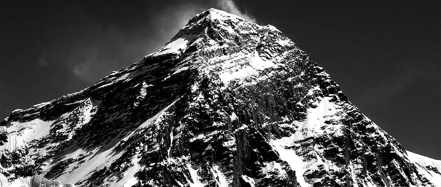 everest — Black and white of high rocky mountain ridge covered with white snow in winter time